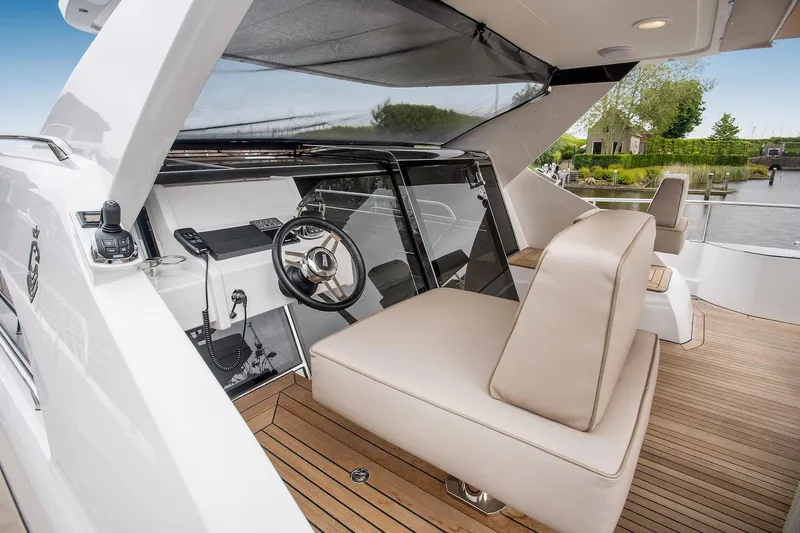  Yacht Photos Pics 2026 Van der Valk Beach Club 600 yacht interior with modern helm and seating area.