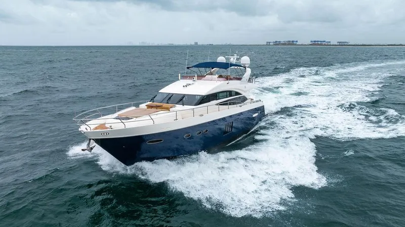  Yacht Photos Pics 2012 Princess 72 Motor Yacht cruising on open sea under cloudy skies.