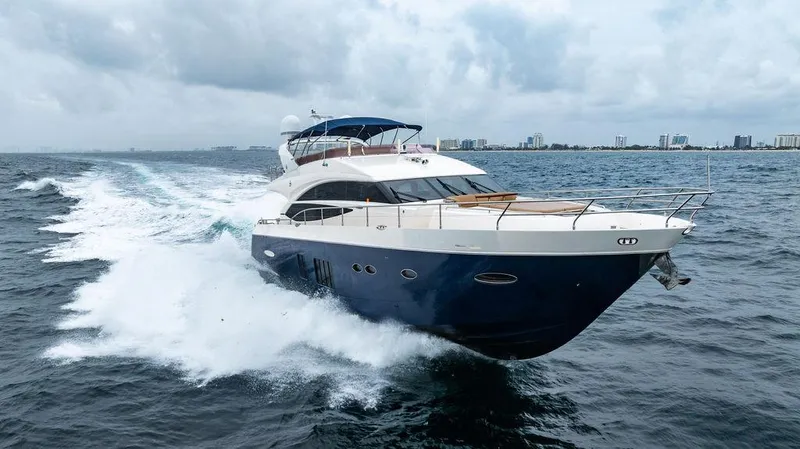  Yacht Photos Pics Luxurious 2012 Princess 72 Motor Yacht cruising on open water.