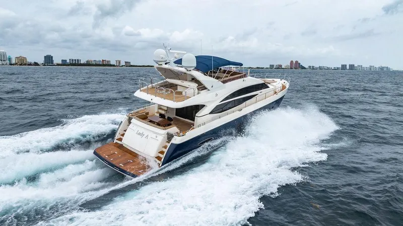  Yacht Photos Pics Luxurious 2012 Princess 72 Motor Yacht cruising on open water.