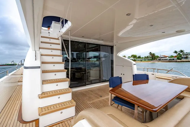  Yacht Photos Pics Luxurious 2012 Princess 72 Motor Yacht with elegant outdoor seating and staircase.