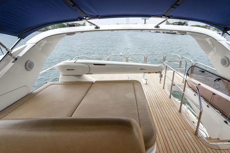  Yacht Photos Pics Luxurious 2012 Princess 72 Motor Yacht deck with sunbed and ocean view.
