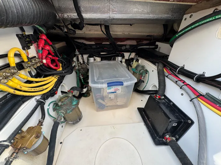  Yacht Photos Pics Engine compartment of a 2015 Pursuit OS 385 Offshore boat with wiring and components.