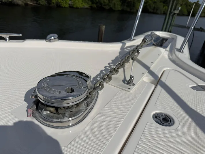  Yacht Photos Pics 2015 Pursuit OS 385 Offshore boat anchor chain and winch on deck.
