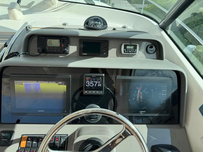  Yacht Photos Pics Control panel of a 2015 Pursuit OS 385 Offshore boat with navigation displays.