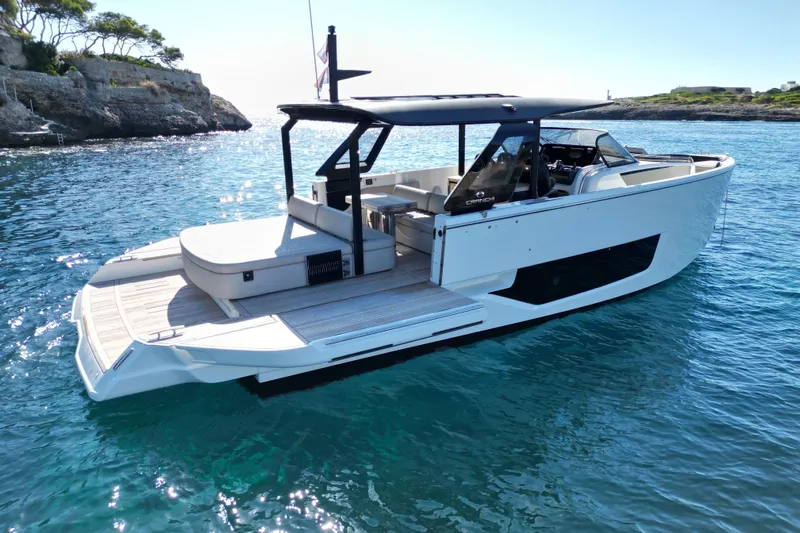  Yacht Photos Pics 2022 Cranchi A46 Luxury Tender yacht on clear blue water, showcasing sleek design.