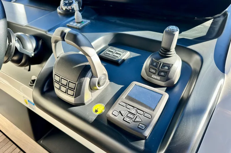  Yacht Photos Pics Control panel of 2022 Cranchi A46 Luxury Tender with joystick and throttle controls.