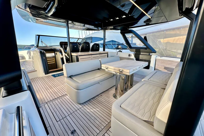  Yacht Photos Pics 2022 Cranchi A46 Luxury Tender interior with elegant seating and modern design.