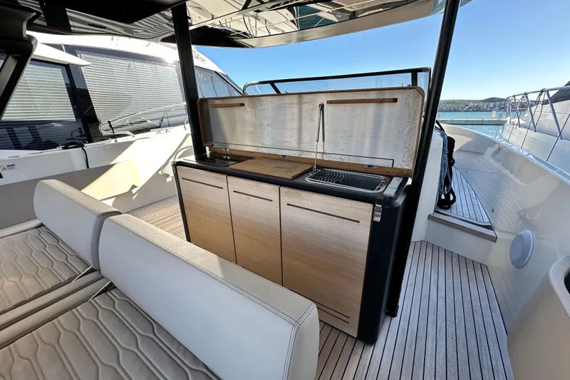  Yacht Photos Pics 2022 Cranchi A46 Luxury Tender with sleek outdoor kitchen and seating area.