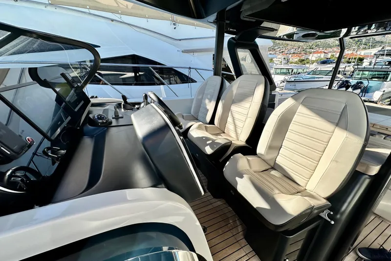  Yacht Photos Pics Interior of 2022 Cranchi A46 Luxury Tender with modern helm and seating.