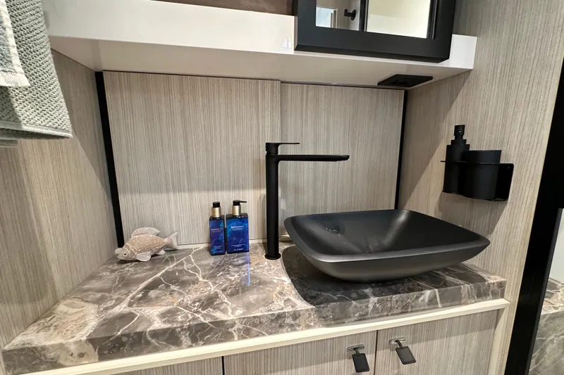  Yacht Photos Pics Modern bathroom sink in 2022 Cranchi A46 Luxury Tender with marble countertop.