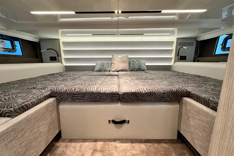  Yacht Photos Pics Luxurious interior cabin of 2022 Cranchi A46 Luxury Tender with stylish bedding.