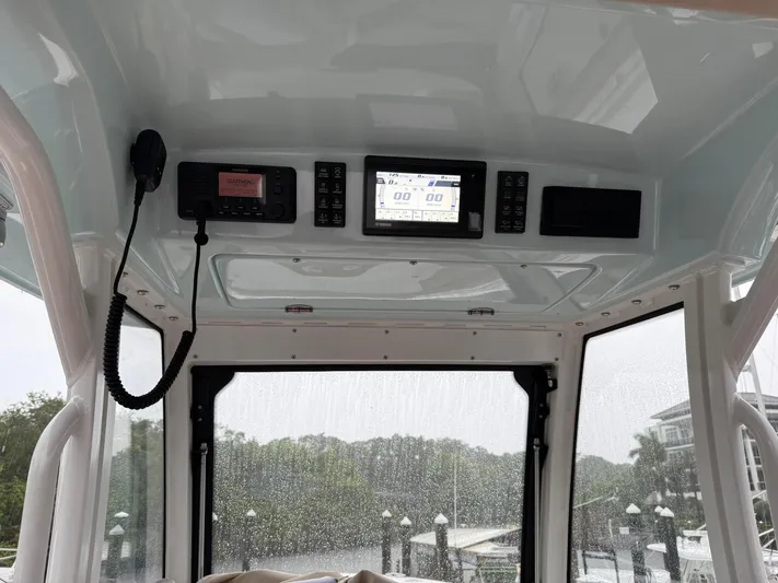  Yacht Photos Pics 2023 Everglades 285 Center Console boat dashboard with navigation and communication equipment.