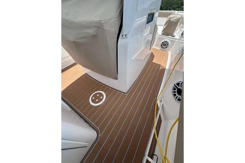  Yacht Photos Pics 2023 Everglades 285 Center Console boat deck with teak flooring and covered console.