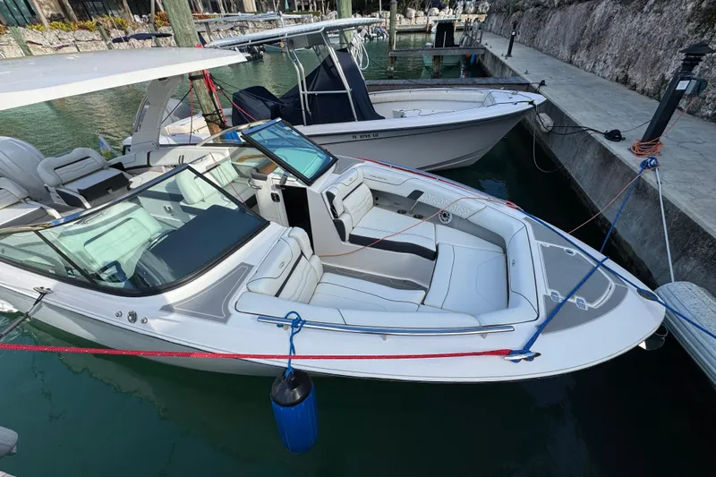  Yacht Photos Pics 2024 Regal LX9 boat docked, featuring sleek design and spacious seating.