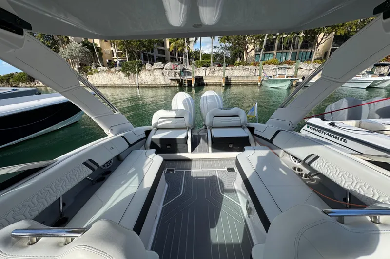  Yacht Photos Pics 2024 Regal LX9 boat interior with luxurious seating and modern design in a marina setting.