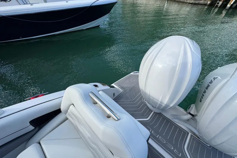  Yacht Photos Pics 2024 Regal LX9 boat with Yamaha engines, featuring sleek white seating and deck design.