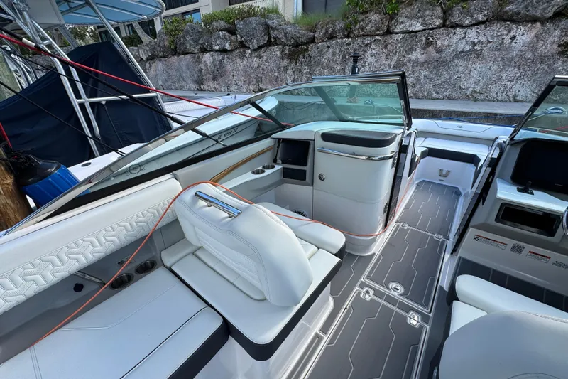  Yacht Photos Pics 2024 Regal LX9 boat interior with sleek white seating and modern dashboard design.