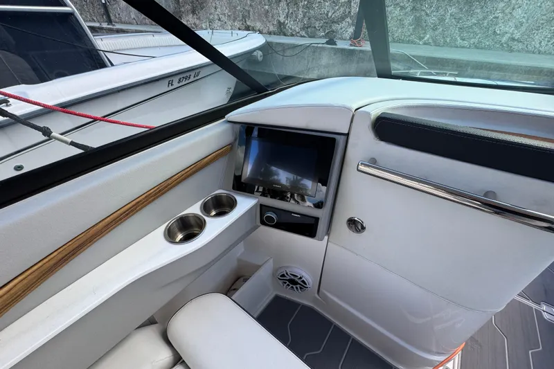  Yacht Photos Pics Interior of 2024 Regal LX9 boat with modern dashboard and cup holders.
