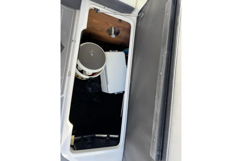  Yacht Photos Pics 2024 Regal LX9 storage compartment with cooler and bucket inside.