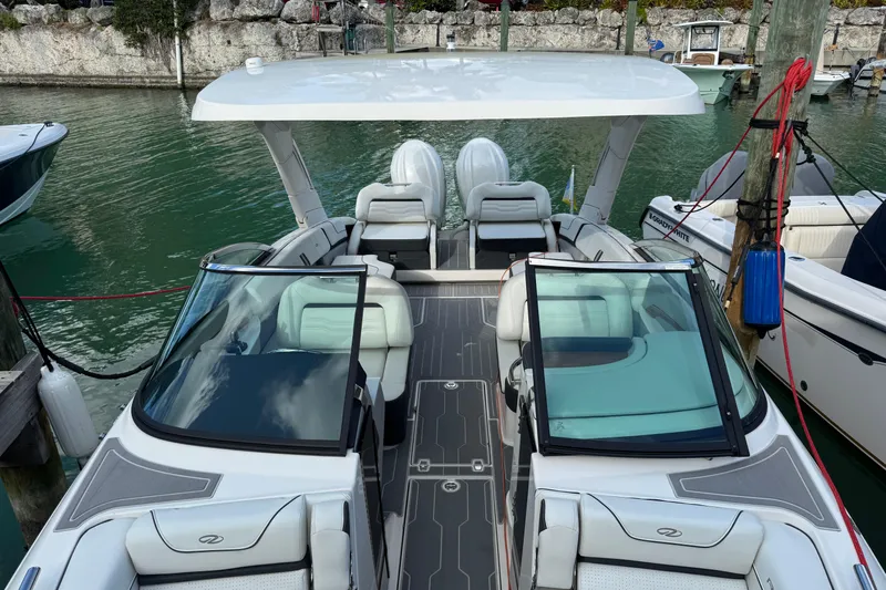  Yacht Photos Pics 2024 Regal LX9 boat docked, featuring sleek design and spacious seating.