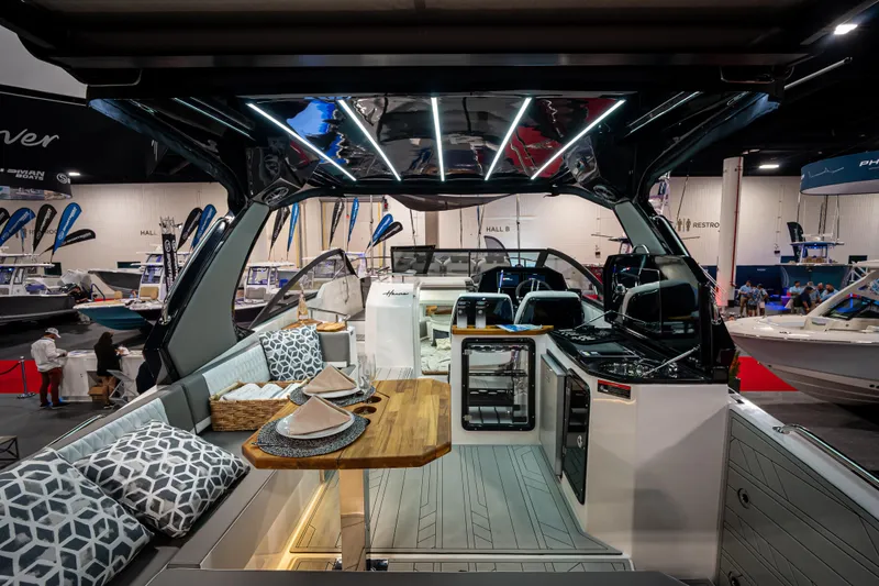  Yacht Photos Pics Luxurious Hanover 347 boat interior with modern design, featuring elegant seating and dining area, 2026 model.