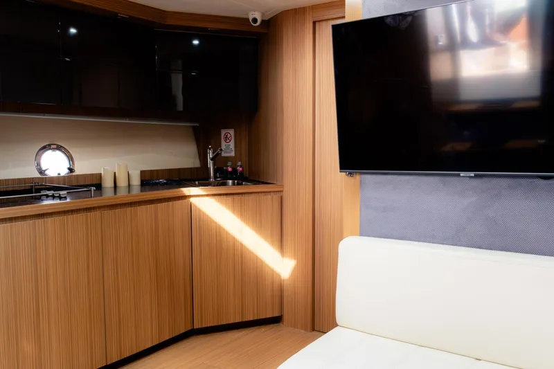  Yacht Photos Pics Interior of 2013 Azimut Atlantis 48 yacht with modern kitchen and TV.