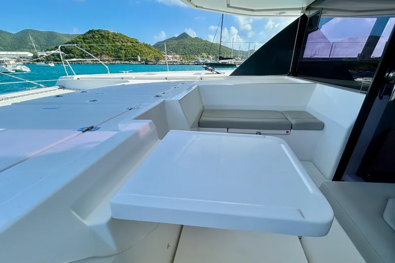  Yacht Photos Pics Leopard 50 yacht interior with seating and table, scenic ocean view, 2020 model.