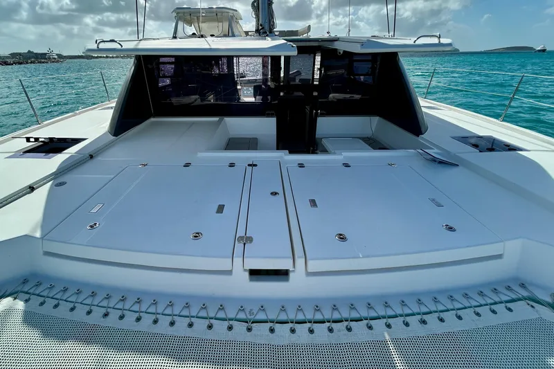  Yacht Photos Pics 2020 Leopard 50 yacht deck with sleek design, anchored in turquoise waters.