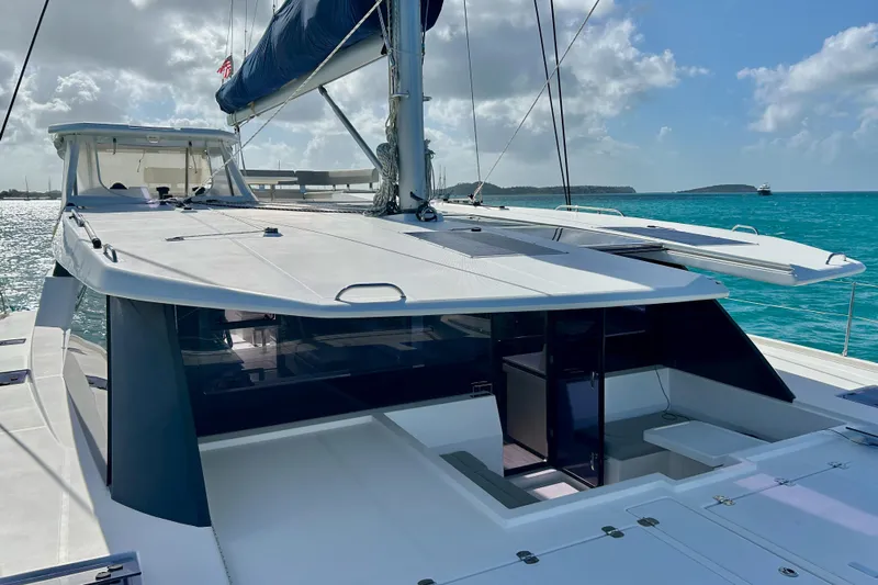  Yacht Photos Pics 2020 Leopard 50 catamaran on turquoise water under a clear blue sky.