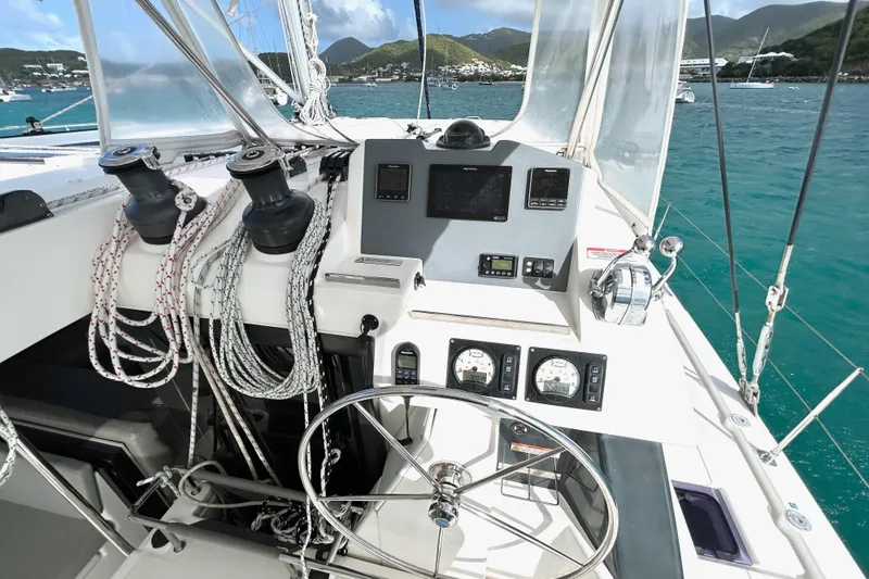  Yacht Photos Pics Helm of 2020 Leopard 50 catamaran with navigation instruments and ocean view.