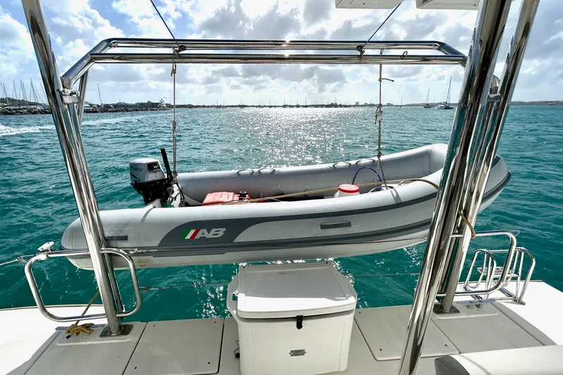  Yacht Photos Pics 2020 Leopard 50 yacht with dinghy on davits, sailing in sunny waters.