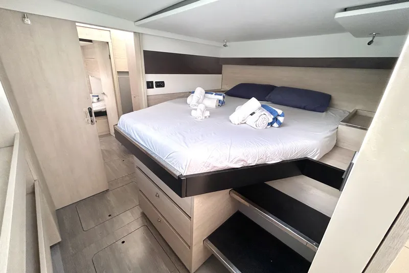 Yacht Photos Pics Luxurious bedroom interior of 2020 Leopard 50 yacht with modern design and cozy bedding.