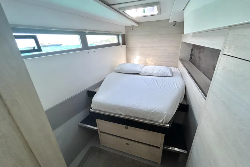  Yacht Photos Pics Cozy bedroom in 2020 Leopard 50 yacht with modern design and ocean view.