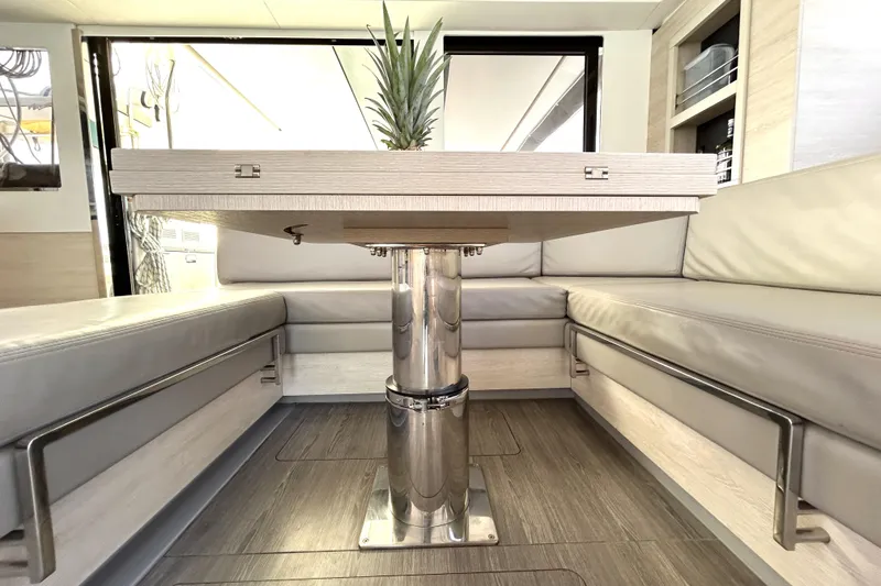  Yacht Photos Pics Modern interior of 2020 Leopard 50 yacht with sleek table and seating.