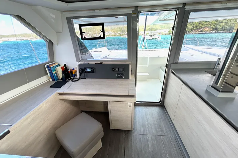  Yacht Photos Pics Modern Leopard 50 yacht interior with navigation desk, ocean view, and sleek design, 2020 model.