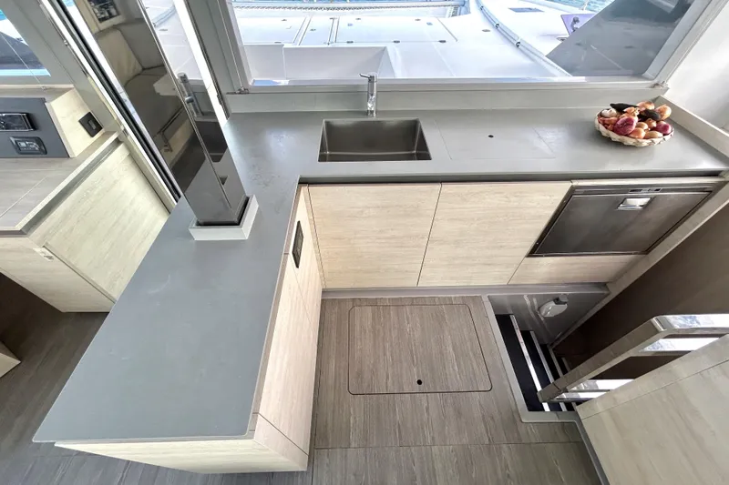  Yacht Photos Pics Modern kitchen in a 2020 Leopard 50 yacht with sleek countertops and stainless steel appliances.