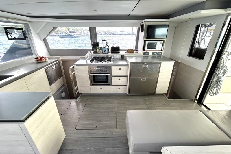  Yacht Photos Pics Modern kitchen interior on a 2020 Leopard 50 yacht, featuring sleek appliances and ocean view.