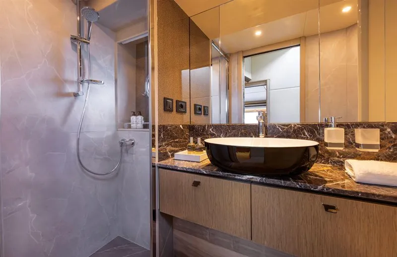 Absolute 60 Fly Yacht Photos Pics Luxurious bathroom in 2025 Absolute 60 Fly yacht with modern fixtures and elegant design.