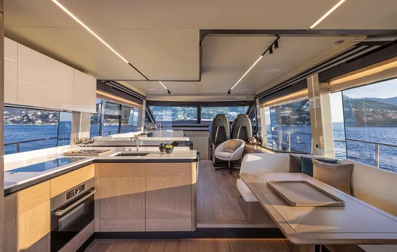 Absolute 60 Fly Yacht Photos Pics Luxurious interior of 2025 Absolute 60 Fly yacht with modern kitchen and seating area.