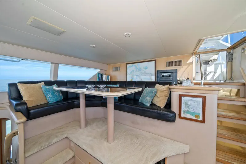 Think B.i.g Yacht Photos Pics Luxurious interior of 1995 Westport 106 Raised Pilothouse yacht with plush seating and ocean view.