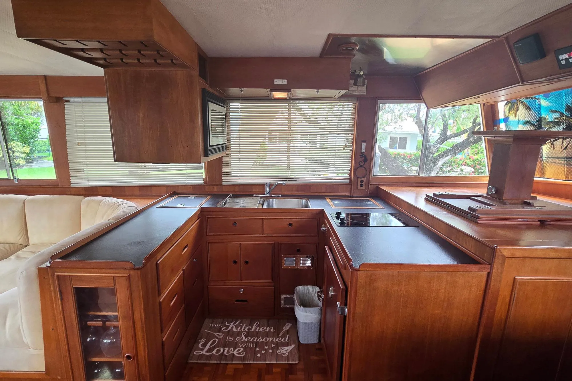 Interior of 1997 Grand Banks 46 Europa yacht with wooden kitchen and modern appliances.