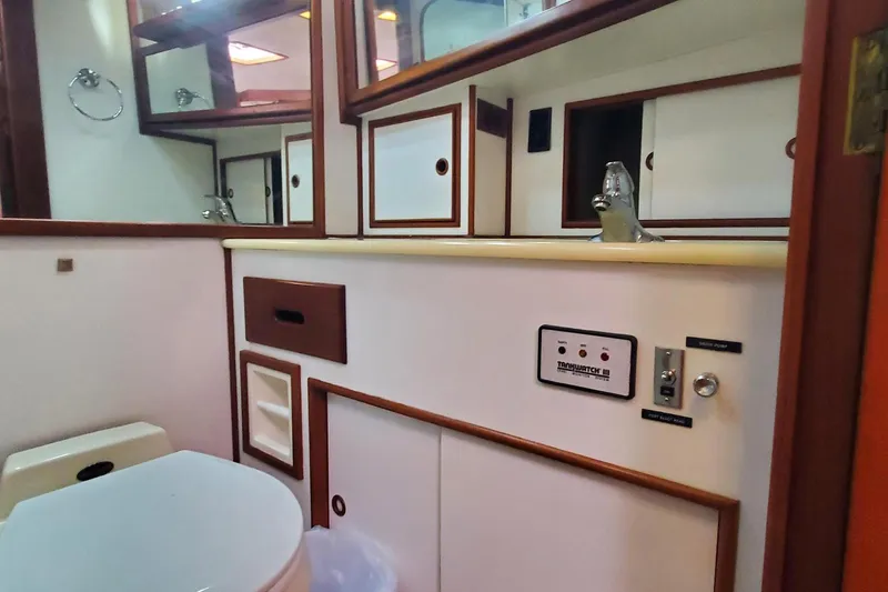 Safari Yacht Photos Pics Bathroom interior of 1997 Grand Banks 46 Europa yacht, featuring sink and storage cabinets.