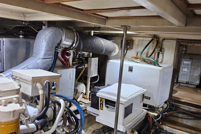 Safari Yacht Photos Pics Engine room of 1997 Grand Banks 46 Europa yacht, featuring mechanical equipment and wiring.