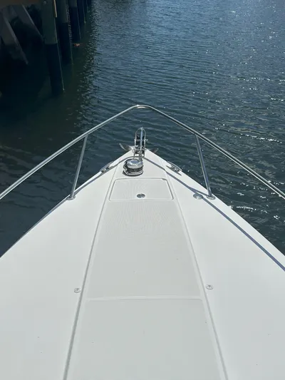  Yacht Photos Pics Bow of 2004 Formula 330 SS boat on calm water.