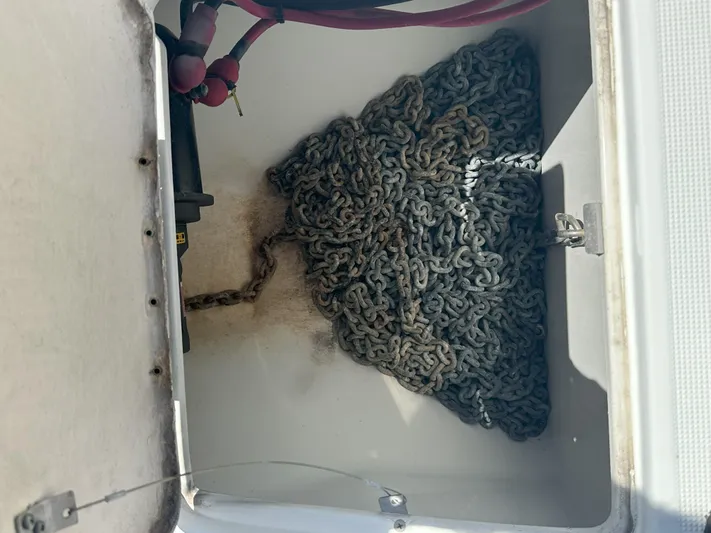  Yacht Photos Pics Anchor chain storage compartment of a 2004 Formula 330 SS boat.