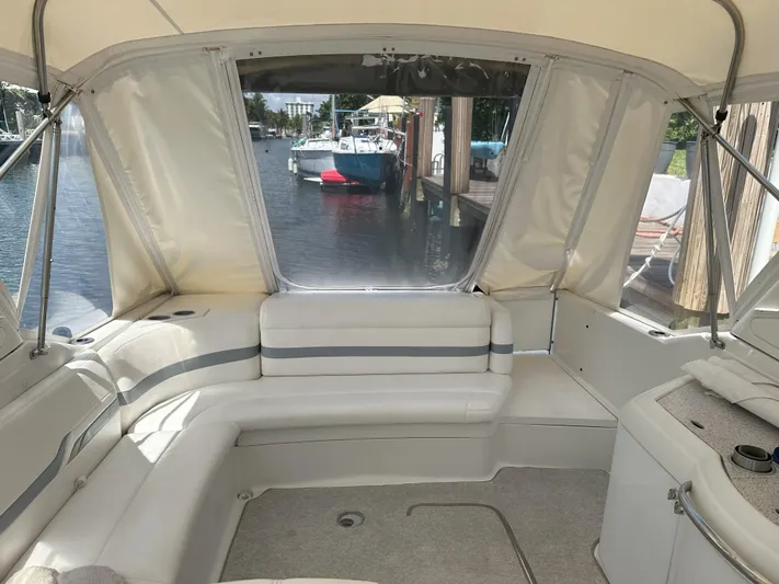  Yacht Photos Pics Interior of a 2004 Formula 330 SS boat with white seating and waterfront view.