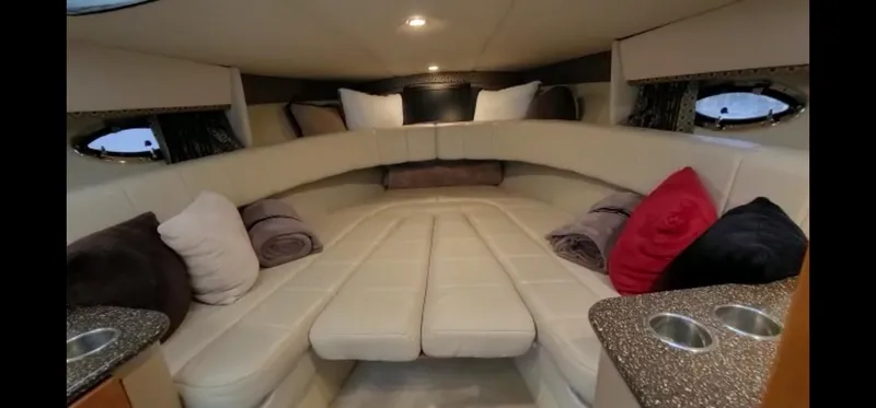  Yacht Photos Pics Interior of a 2004 Formula 330 SS boat with plush seating and pillows.