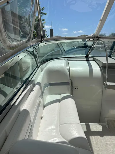  Yacht Photos Pics Interior view of a 2004 Formula 330 SS boat with white seating.