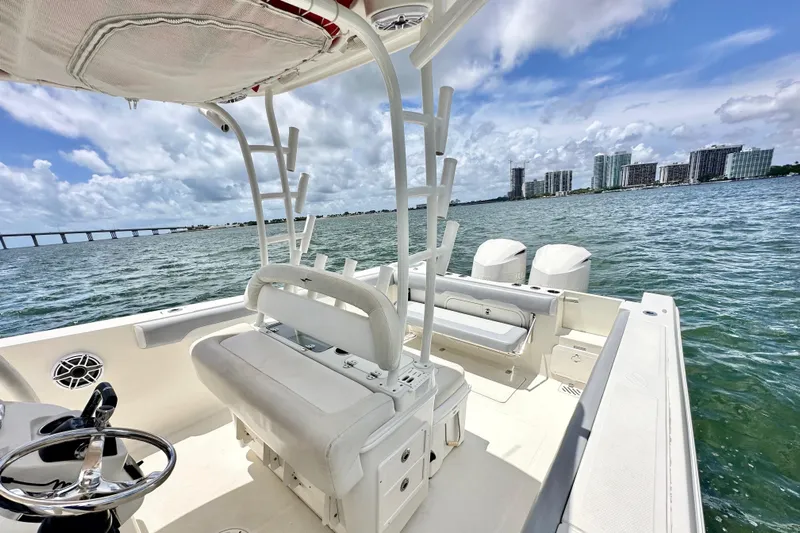 Why Knot Yacht Photos Pics 2014 Sailfish 320 CC boat interior with ocean view and city skyline.